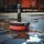 A professional team of workers applying waterproofing material to a basement wall, photo