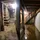 A before and after comparison of a damp, moldy basement and a dry, clean basement, photo